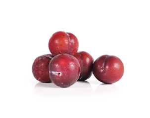Plums close up isolated on white background