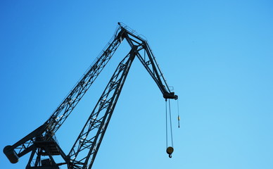 metal industrial crane in blue sky