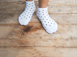 feet wearing white polka dot socks