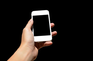 Woman hand hold a white phone,isolated in black.