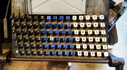 Vintage Linotype printing press keyboard used for hot metal typesetting and publishing.