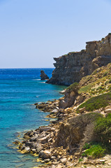 Fototapeta na wymiar Rocky coast at south part of Crete island, near Triopetra 