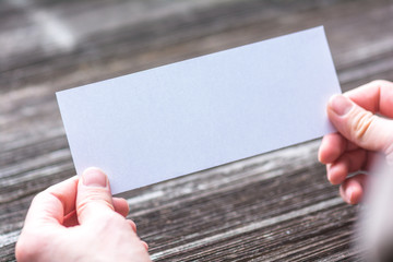 Obraz premium hands with white blank paper