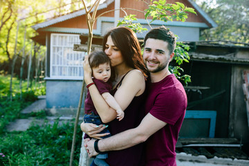 young family with a child on the nature