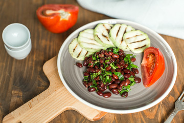 Bean lobio with zucchini on grill