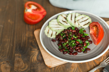 Bean lobio with zucchini on grill