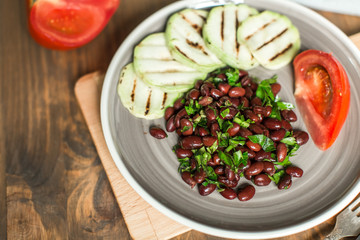 Bean lobio with zucchini on grill