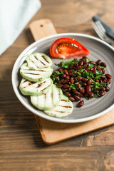 Bean lobio with zucchini on grill