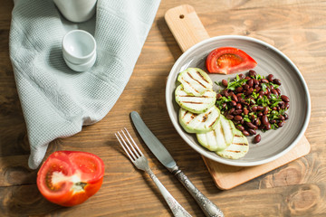 Bean lobio with zucchini on grill