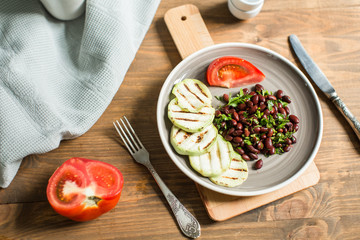 Bean lobio with zucchini on grill