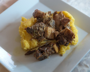 Roasted goat and polenta above