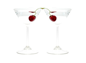 Two glasses of alcohol drink with cherry isolated on white background