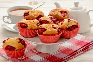 Strawberry muffins on the white plate. 
