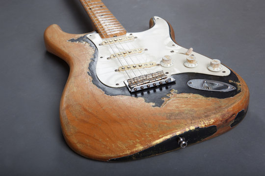 Electric guitar on grey background