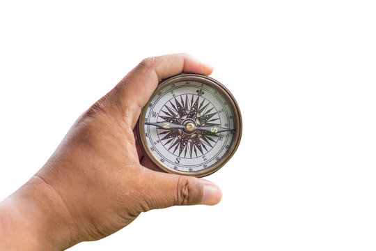 Compass on man hand on isolated with clipping path.