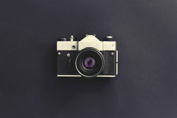 Vintage camera on a dark background. Film cameras that had been popular in the past