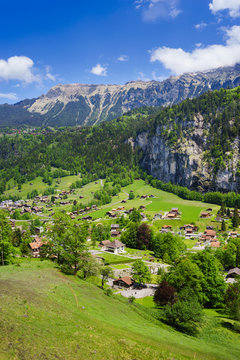 Panorama view of Lauterbrunnen with train going to the famous mountain Jungfraujoch