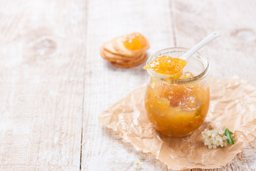 Fresh juicy fruity jam with figs in a jar with crackers and cottage cheese for breakfast, horizontal, with copy space
