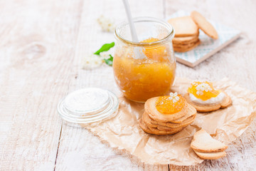 Fresh juicy jam with figs in a jar with crackers and cottage cheese for breakfast, horizontal, with copy space