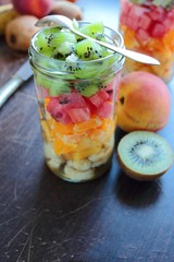 Jar with fresh fruits and spoon