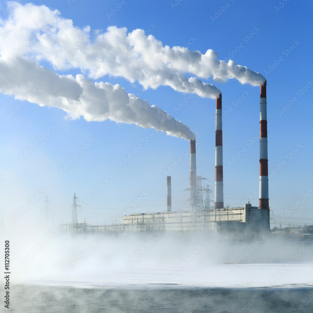 Wall mural Hydroelectric power plant in winter