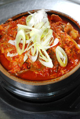 korean kimji soup in hot stone bowl
