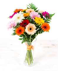 colorful bouquet of gerberas in a vase isolate on white © smspsy
