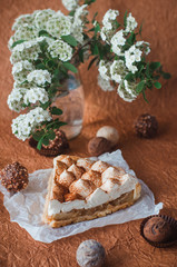 Apple pie with whipped cream covered by grated chocolate