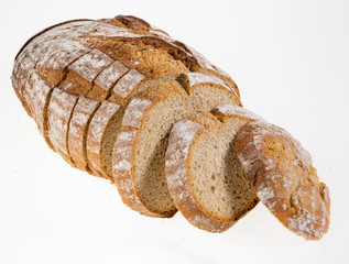 Slices of Rye bread loaf on a white background.
