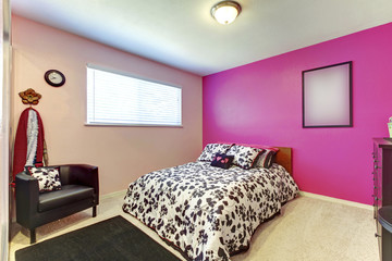 Teenager girl bedroom with bright pink wall and simple interior