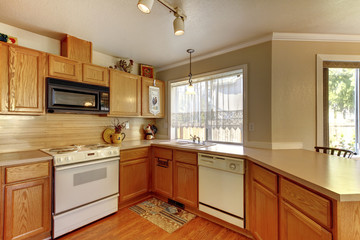 American typical kitchen interior with white appliances.