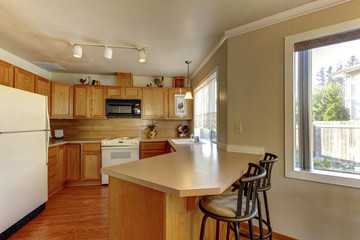 American typical kitchen interior with white appliances.