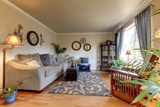 Cozy Living room design with nice decor, large beige sofa.