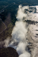 Fototapeta na wymiar Aerial view of Victoria Falls creating spray
