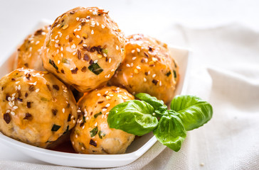 Chicken meatballs under sweet chili pepper sauce