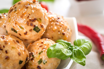 Chicken meatballs under sweet chili pepper sauce
