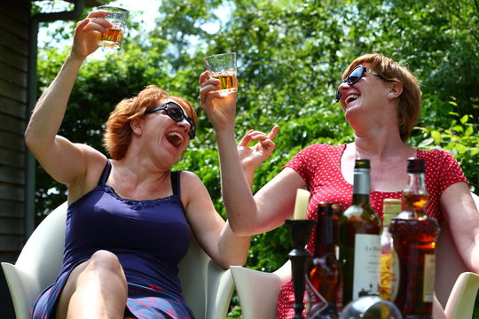 fun/ twom women having fun while drinking alcohol