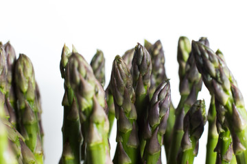 Bunch of asparagus on a table. Uncooked pile raw for organic, vegetarian cuisine, delicious fresh, healthy ingredient. Closeup and copy space.