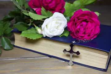 rose book and cross