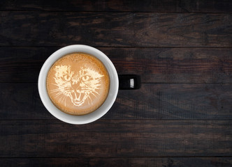 Latte art - portrait of kangaroo made on froth on a cup of coffee. Top view with copy space
