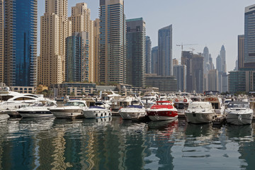 Fototapeta na wymiar speedboats in yacht club of Marina district in Dubai