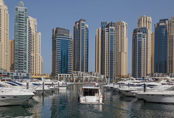 Fototapeta na wymiar speedboats in yacht club of Marina district in Dubai
