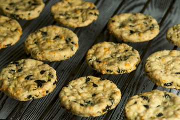 Tasty cookies with olives, rosemary and cheese