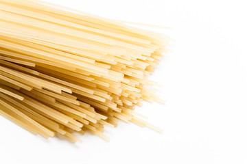 Raw spaghetti on white background.