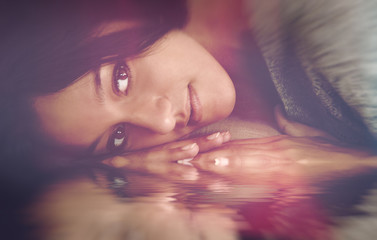 Evocative portrait of a pensive young woman