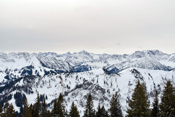 Fototapeta na wymiar Panoramic scene of snow-covered alpine mountains