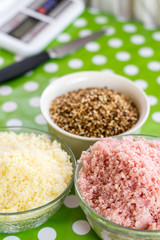 Grated yellow cheese, grated ham and baked sesame