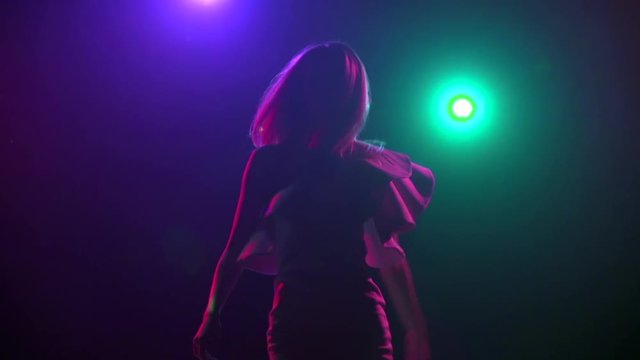 Close-up of silhouette girl in dancing. Slow motion