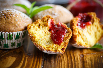 sweet baked muffins with jam inside