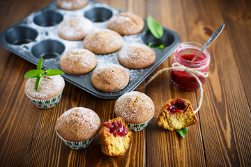 sweet baked muffins with jam inside